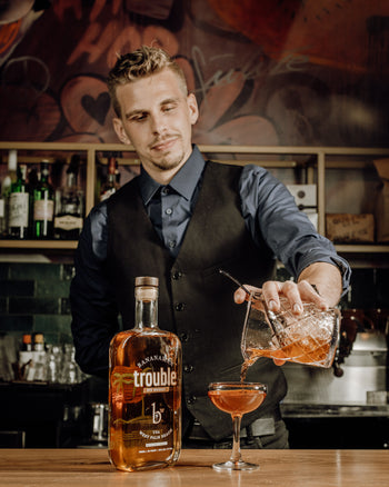 Bartender Pouring A Cocktail
